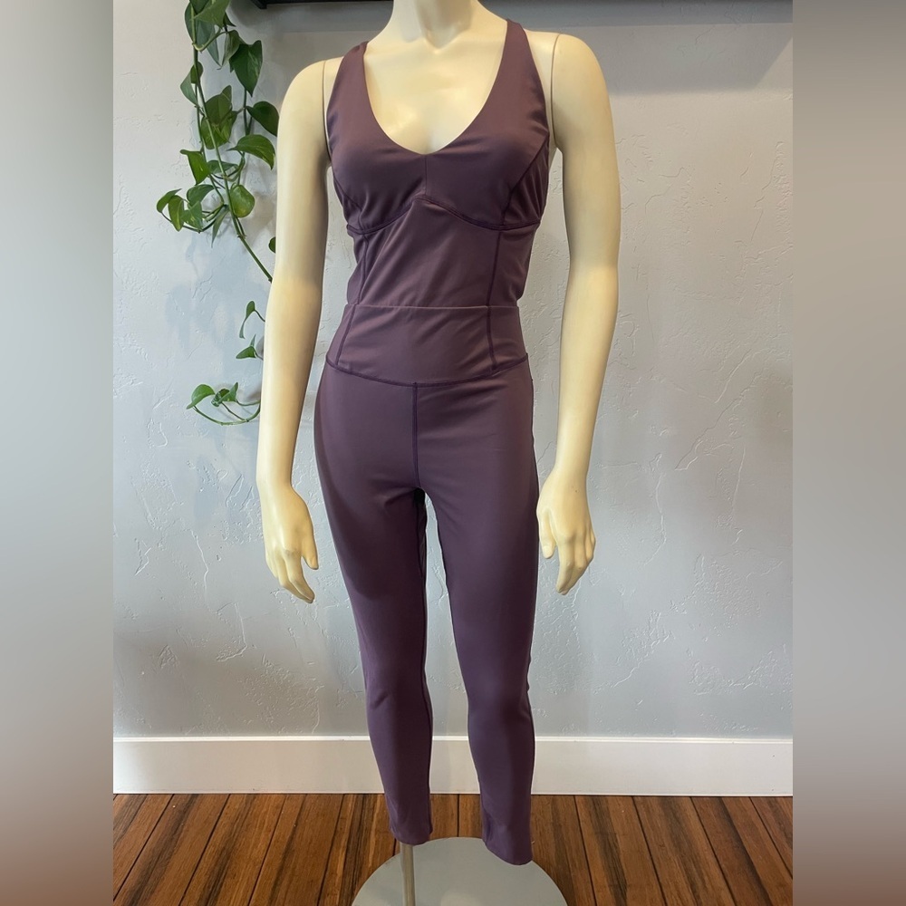 Free people movement hot shot, strappy onesie in mauve/purple size M